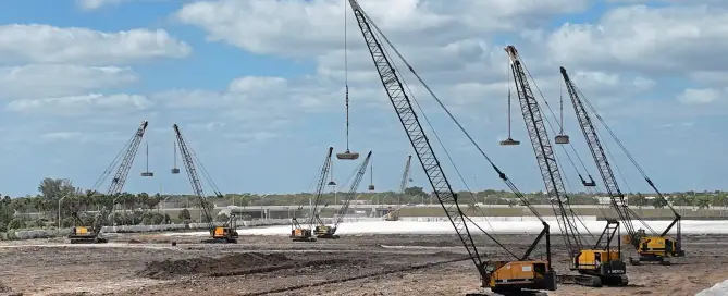 Construction vibration monitoring equipment measuring ground movement during compaction